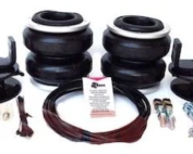 Air suspension kit components laid out: four air springs, brackets, hoses, bolts, and hardware