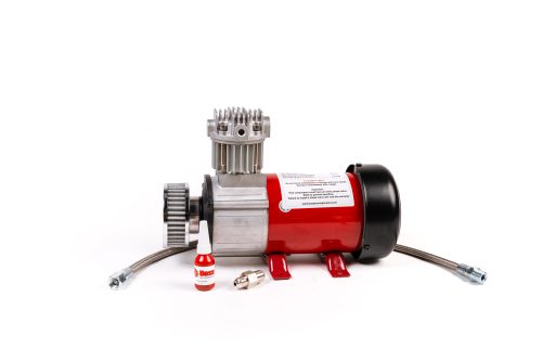 Air compressor components on a white background: red tank, silver motor, connected hoses, and small bottle of red sealant in front.